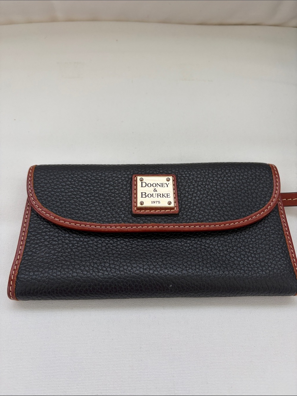 Dooney & Bourke Black Pebbled Leather Wallet with Brown Trim and Logo Plaque EUC